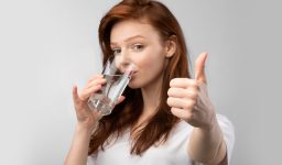 How does fluoride treatment help with sensitivity?